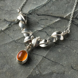 Fancy silver leaf necklace set with fire opal