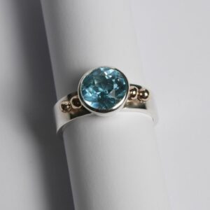 Silver ring set with blue topaz