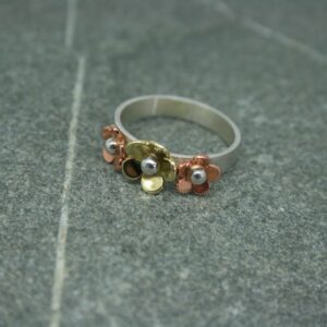 Silver, copper and brass three flower ring