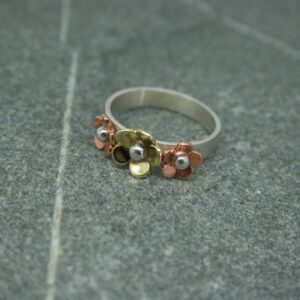 Silver, copper and brass three flower ring