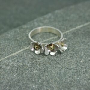 Silver three daisy ring with brass detail