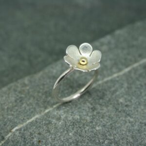 Silver daisy ring with brass detail