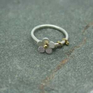Silver daisy ring with brass detail