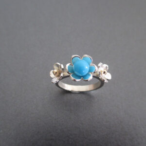 Silver flower ring set with turquoise