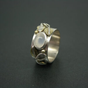 Silver moonstone ring with brass leaf detail