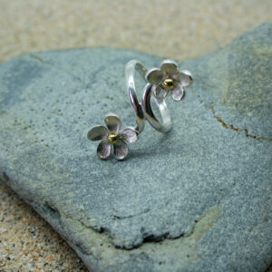 Large silver crossover ring with two flowers